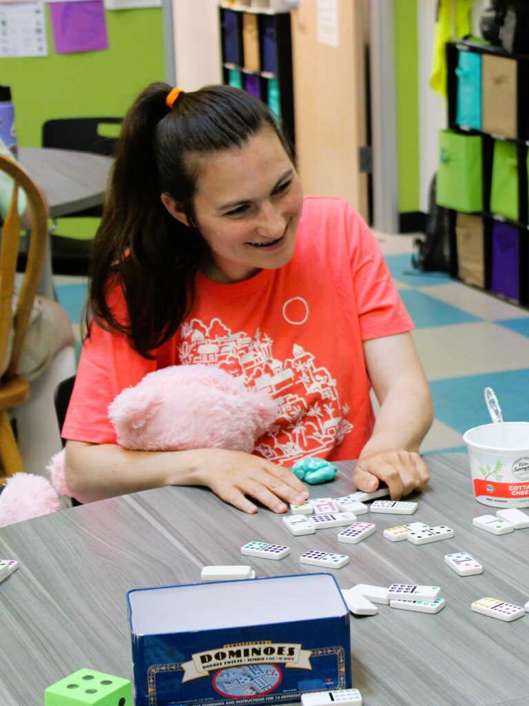 Woman playing dominos