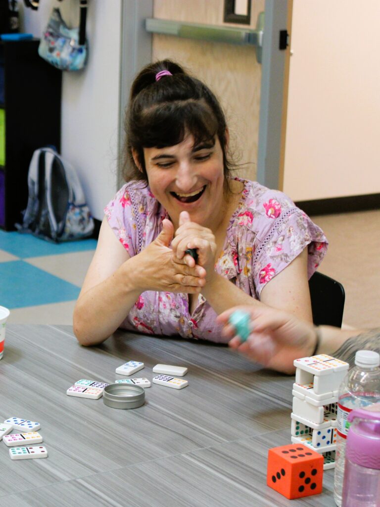 Woman playing dominos