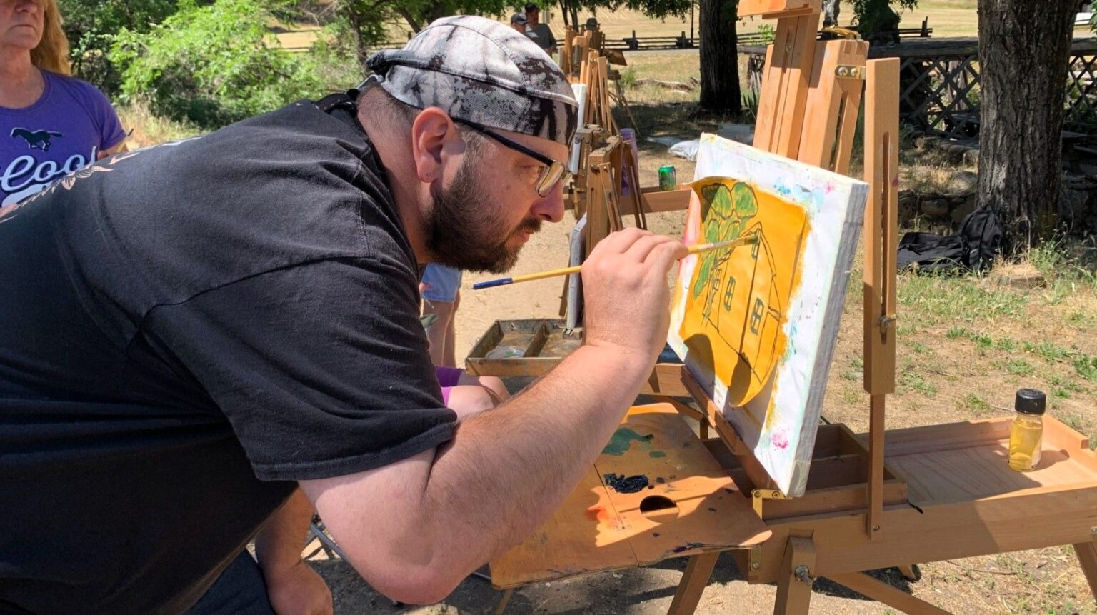 Close up of artist working on a piece