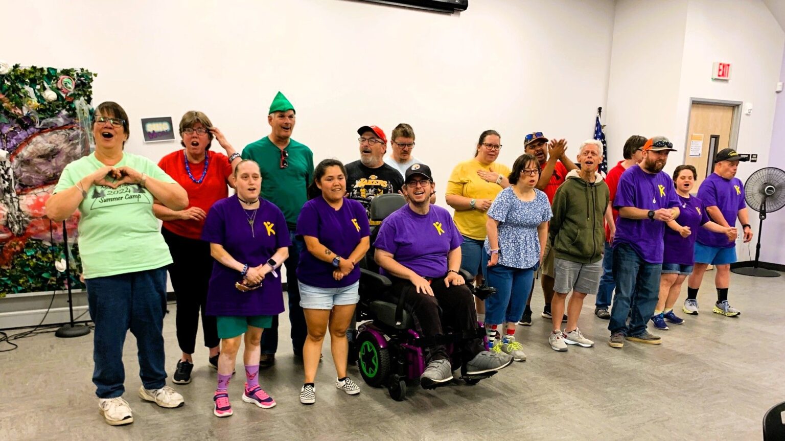 People in a line performing a song