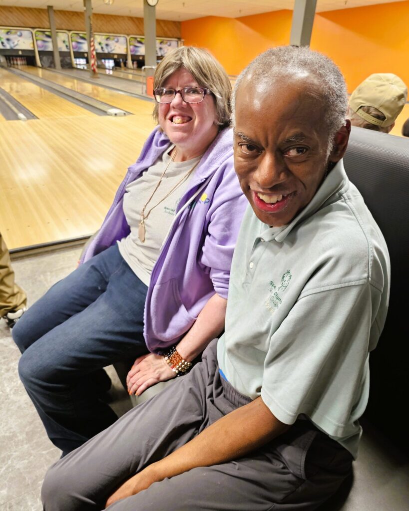 People sitting at bowling alley