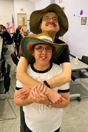 Man with his arms around woman