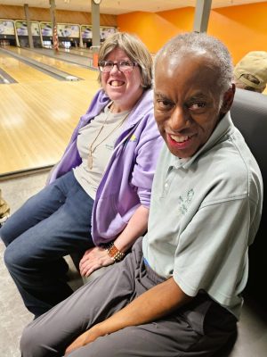 People sitting at bowling alley