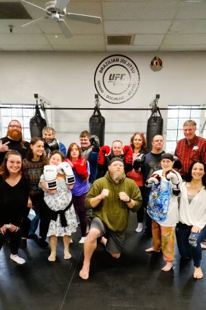 People posing at UFC Gym